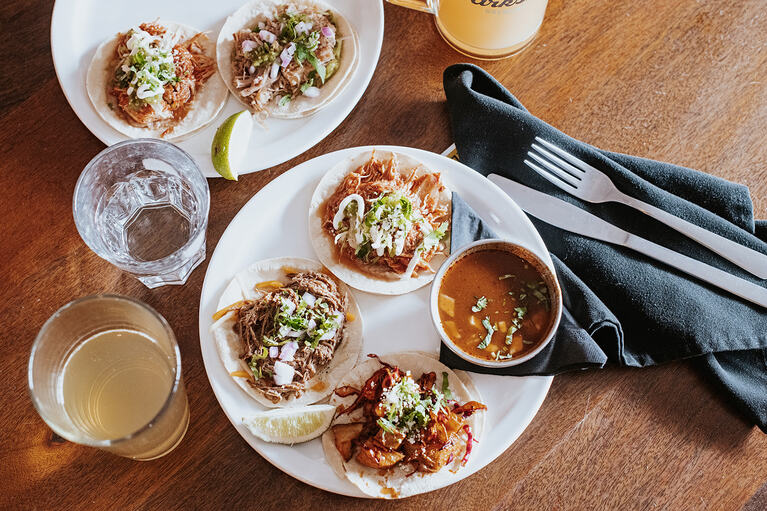 A plate of delicious three assorted tacos.
